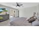 Spacious main bedroom with a large dresser, light gray walls, and sliding doors leading to the backyard at 5236 S 19Th Ave, Phoenix, AZ 85041