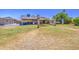 Picture of a large backyard lawn with a covered patio and shed at 5424 E Florian Ave, Mesa, AZ 85206