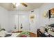 Comfortable bedroom featuring a closet, a ceiling fan and a door, providing functionality and style at 5424 E Florian Ave, Mesa, AZ 85206