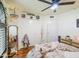 This bedroom showcases decor, a chandelier, a closet, and a window, creating an inviting and comfortable atmosphere at 5424 E Florian Ave, Mesa, AZ 85206