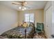 Comfortable bedroom featuring a window, neutral walls, and a ceiling fan at 5424 E Florian Ave, Mesa, AZ 85206