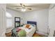 This bedroom has a shuttered window and door, with warm and neutral tones enhancing its appeal at 5424 E Florian Ave, Mesa, AZ 85206
