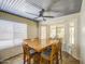 Dining area with bay windows, ceiling fan, and views of the backyard at 5424 E Florian Ave, Mesa, AZ 85206
