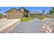 Charming single-Gathering home featuring a well-maintained yard and a two-car garage, offering curb appeal at 5424 E Florian Ave, Mesa, AZ 85206