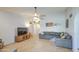 Spacious living room with modern décor, tile flooring, and ample natural light, creating a cozy atmosphere at 5424 E Florian Ave, Mesa, AZ 85206