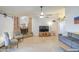 Open-concept living room featuring a brick fireplace, neutral color scheme, and ample natural light at 5424 E Florian Ave, Mesa, AZ 85206