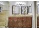 Bathroom features a dual sink vanity, granite countertop, and a tiled walk-in shower at 5424 E Florian Ave, Mesa, AZ 85206