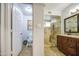 Bathroom features a dual sink vanity, granite countertop, and a tiled walk-in shower at 5424 E Florian Ave, Mesa, AZ 85206