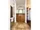 Bathroom featuring light brown cabinetry, an expansive mirror, and tile flooring at 5749 S 247Th Dr, Buckeye, AZ 85326