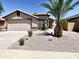 Charming single Gathering home showcasing mature palm trees, well maintained landscaping, and a 2 car garage at 5749 S 247Th Dr, Buckeye, AZ 85326