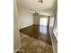 Spacious living room features hardwood floors, large sliding glass doors, and a ceiling fan at 5749 S 247Th Dr, Buckeye, AZ 85326