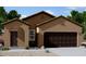 Lovely tan stucco home with dark brown garage door and arched entryway at 5782 E Orion Rd, Florence, AZ 85132