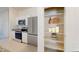 Modern kitchen featuring stainless steel appliances, granite countertops, and white cabinets at 5782 E Orion Rd, Florence, AZ 85132
