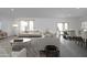 Spacious living and dining area with neutral colors and light-filled windows, perfect for gatherings at 5824 W Coplen Farms Rd, Laveen, AZ 85339