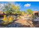 Desert landscaping in the backyard provides a peaceful setting that surrounds the pool and patio areas at 5892 E Carefree Mountain Dr, Carefree, AZ 85377