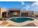 The spacious backyard has a pool, mature landscaping, and desert views at 5892 E Carefree Mountain Dr, Carefree, AZ 85377