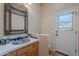 Bathroom featuring a designer sink, a shower, and access to the outdoors at 5892 E Carefree Mountain Dr, Carefree, AZ 85377