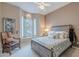 This bedroom has carpet, a bay window, a wooden bed frame, and tasteful decor at 5892 E Carefree Mountain Dr, Carefree, AZ 85377