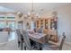 Formal dining area with chandelier, rustic hutch, decorative artwork, and seating for six at 5892 E Carefree Mountain Dr, Carefree, AZ 85377