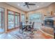 Well-lit dining area with a glass table and access to outdoor pool and patio at 5892 E Carefree Mountain Dr, Carefree, AZ 85377
