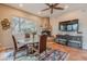 Cozy dining area includes a fireplace, decorative rug, and a large window for plenty of natural light at 5892 E Carefree Mountain Dr, Carefree, AZ 85377