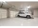 Large three car garage featuring epoxy floors, lots of room for parking and storage at 5892 E Carefree Mountain Dr, Carefree, AZ 85377