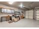 Spacious three car garage with epoxy floors, overhead storage and work desk at 5892 E Carefree Mountain Dr, Carefree, AZ 85377