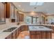 Expansive kitchen offers ample cabinet space, a center island, and a large window with views of the outdoors at 5892 E Carefree Mountain Dr, Carefree, AZ 85377