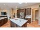 Well-appointed kitchen featuring custom cabinets and stainless steel appliances, plus central island with seating at 5892 E Carefree Mountain Dr, Carefree, AZ 85377