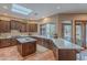 Well-appointed kitchen with custom cabinets, a skylight, and a center island at 5892 E Carefree Mountain Dr, Carefree, AZ 85377