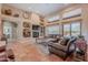 Spacious living room with a fireplace, niches and large windows at 5892 E Carefree Mountain Dr, Carefree, AZ 85377
