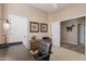 Stylish home office with a rustic wood desk and cabinet plus natural light at 5892 E Carefree Mountain Dr, Carefree, AZ 85377
