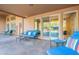 Open-air patio featuring multiple lounging areas and views of the desert landscape and pool at 5892 E Carefree Mountain Dr, Carefree, AZ 85377