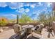 Serene outdoor patio with seating, offering beautiful desert views for relaxation and entertaining at 5892 E Carefree Mountain Dr, Carefree, AZ 85377