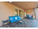 Inviting covered patio with cozy furniture, ideal for enjoying the tranquil desert setting at 5892 E Carefree Mountain Dr, Carefree, AZ 85377
