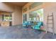 Covered patio area features comfortable seating, providing a serene space for relaxation at 5892 E Carefree Mountain Dr, Carefree, AZ 85377