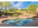 Inviting backyard with a refreshing pool and serene desert landscaping creating a peaceful oasis at 5892 E Carefree Mountain Dr, Carefree, AZ 85377