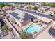 Aerial view of home featuring pool, covered patio, solar panels and fenced yard at 729 W Silver Reef Dr, Casa Grande, AZ 85122