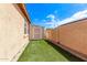 Low maintenance backyard with shed and artificial turf at 729 W Silver Reef Dr, Casa Grande, AZ 85122
