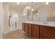 Bathroom featuring a double vanity, pendant lights, and walk-in shower with glass door at 729 W Silver Reef Dr, Casa Grande, AZ 85122