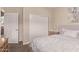 Bedroom with an open closet, bed, end table and neutral walls at 729 W Silver Reef Dr, Casa Grande, AZ 85122