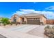 Inviting one-story home with a desert-landscaped front yard and a spacious driveway leading to a two-car garage at 729 W Silver Reef Dr, Casa Grande, AZ 85122