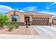 Charming single-story home featuring a well-maintained front yard and a two-car garage at 729 W Silver Reef Dr, Casa Grande, AZ 85122