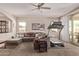Cozy living room featuring plush carpet, a ceiling fan, and sliding glass doors leading to the backyard at 729 W Silver Reef Dr, Casa Grande, AZ 85122