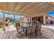 Enjoy outdoor living under a covered patio with pool and hot tub views at 729 W Silver Reef Dr, Casa Grande, AZ 85122