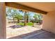 Covered patio offers a shaded view of the landscaped backyard, perfect for relaxing outdoors at 7365 W Magdalena Ln, Laveen, AZ 85339