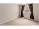 Inviting bedroom featuring a window with curtains providing natural light at 7365 W Magdalena Ln, Laveen, AZ 85339