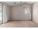 Large bedroom featuring vaulted ceiling and a sliding glass door to the backyard at 7365 W Magdalena Ln, Laveen, AZ 85339