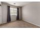 Serene bedroom with a window, offering a tranquil space and ample natural light at 7365 W Magdalena Ln, Laveen, AZ 85339