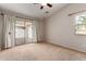 Spacious bedroom featuring a sliding glass door to the backyard at 7365 W Magdalena Ln, Laveen, AZ 85339